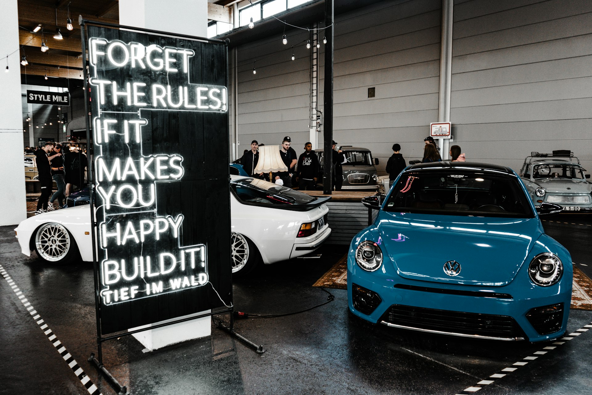 a couple of cars parked in a garage